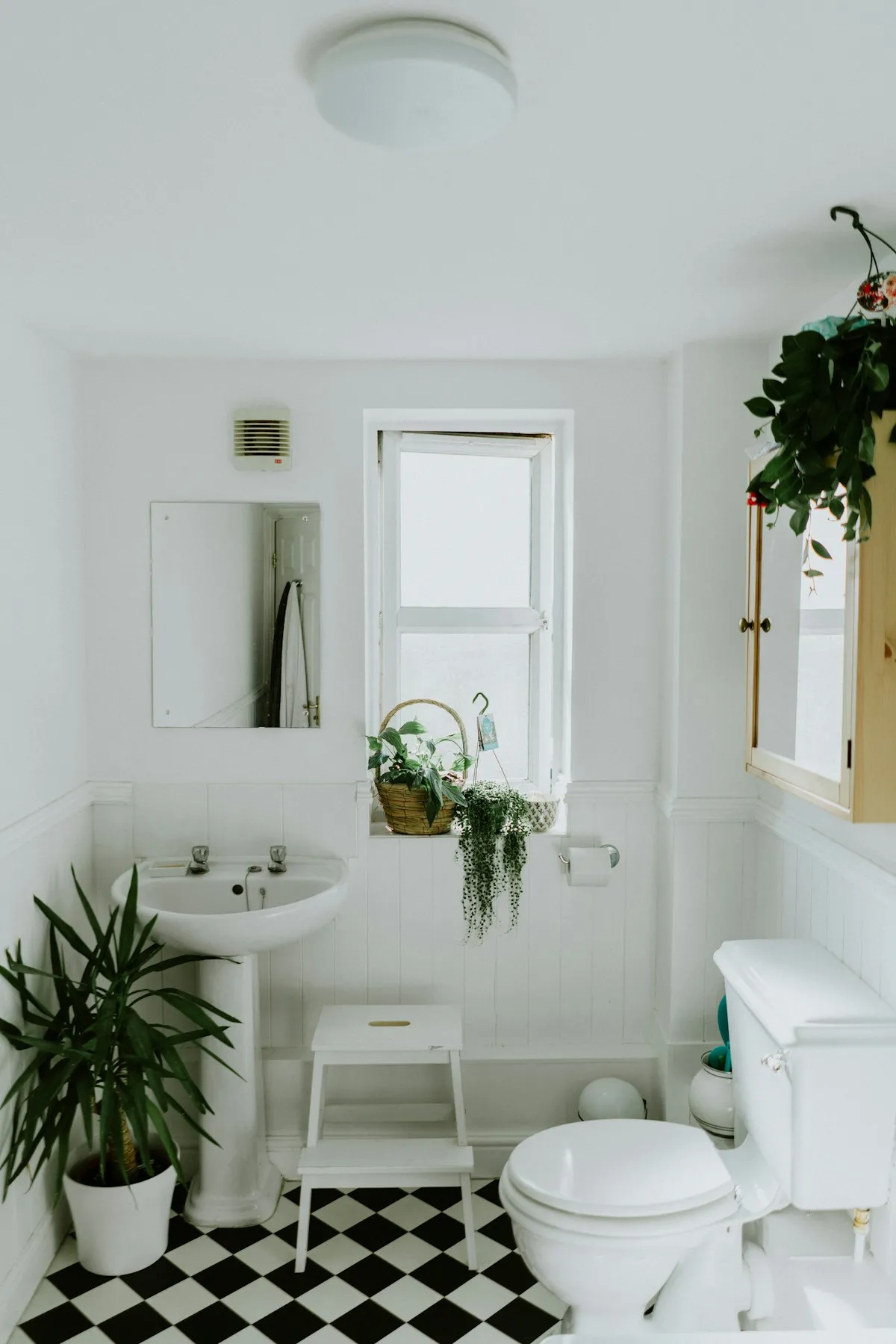 Modern renovated bathroom with walk-in shower, floating vanity, and contemporary tile work