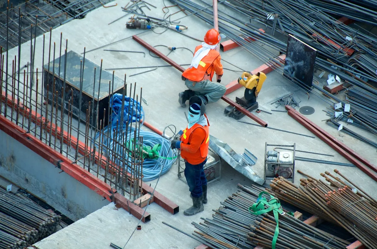 Commercial construction site with workers and equipment