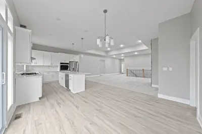 Dining, kitchen, and living open concept - custom home in Tallmadge Ohio