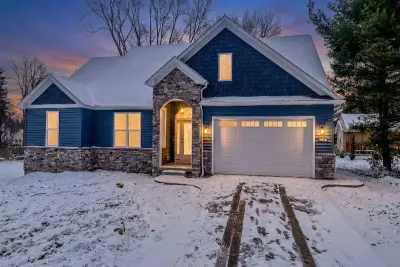 Exterior illuminated at dusk - custom home in Tallmadge Ohio